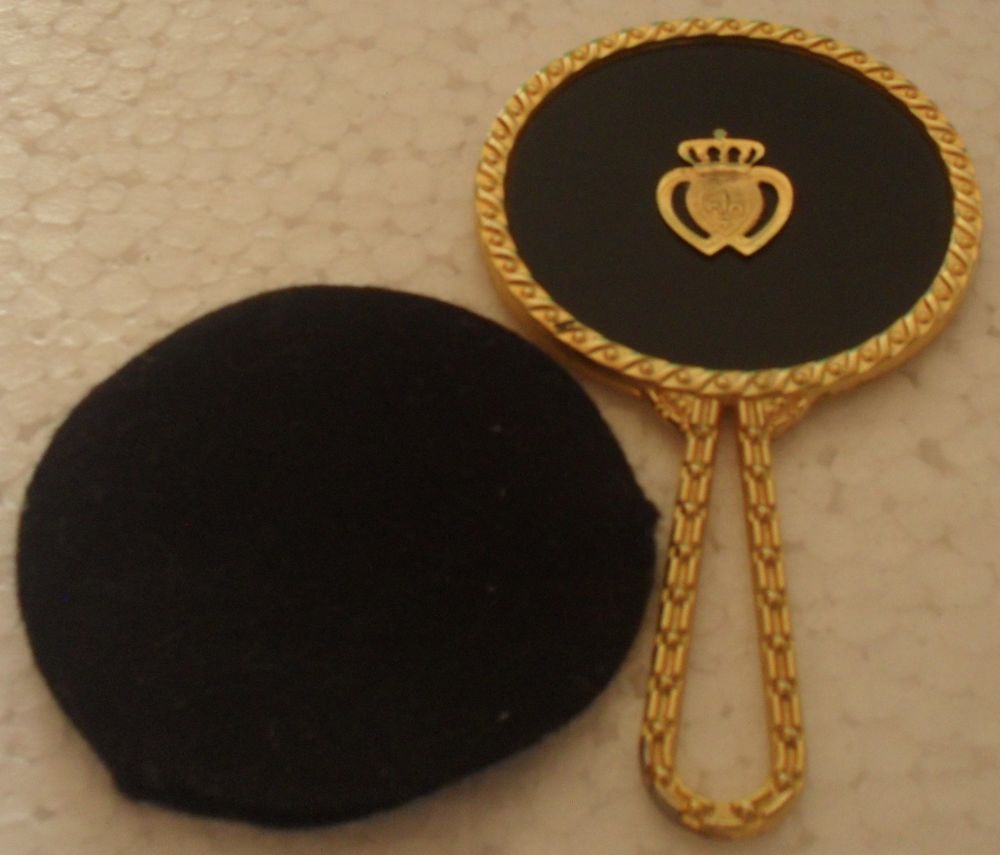 Petit miroir rond dor&eacute; de poche avec sa housse. Bijoux et montres