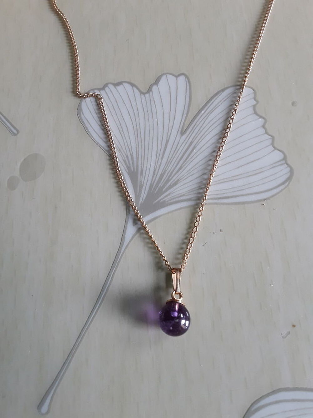 Pendentif perle violette Bijoux et montres