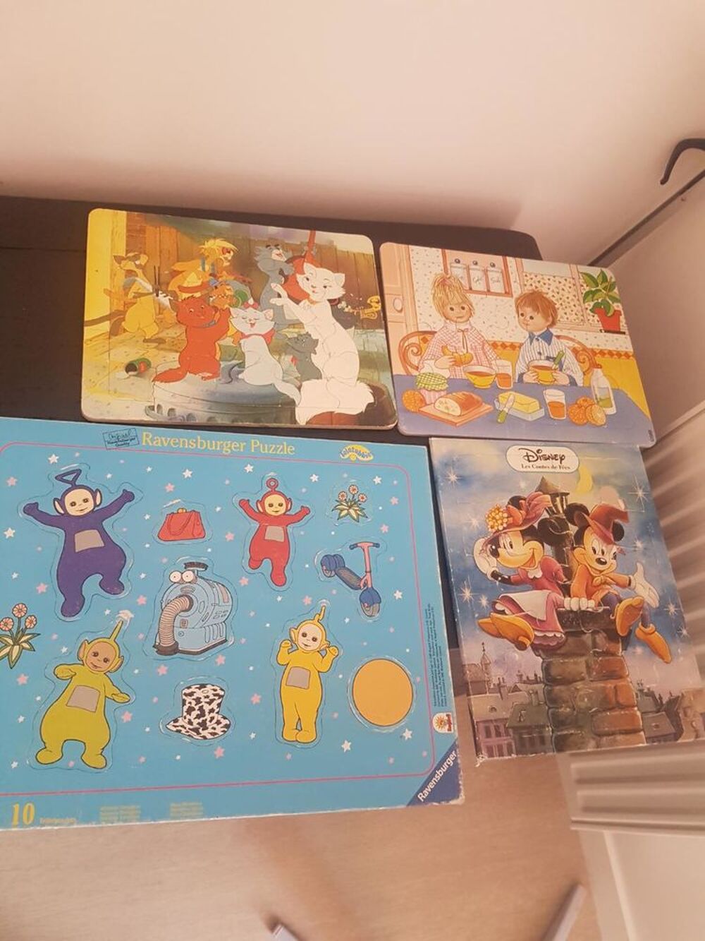 4 puzzles + 1 livre Jeux / jouets