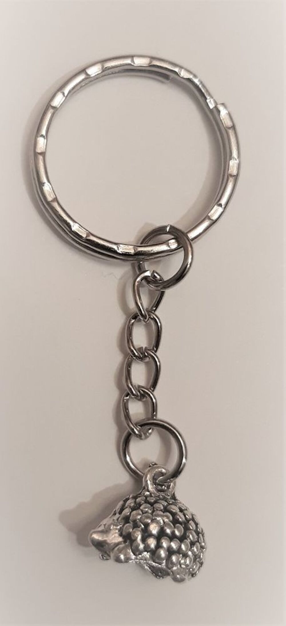 porte cl&eacute; h&eacute;risson en acier Bijoux et montres