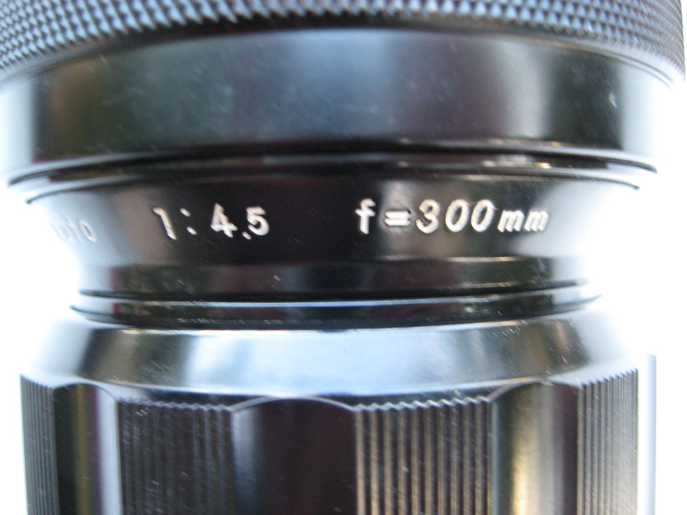 Nikon Nikkor 300 mm f 4,5 non AI premier mod&egrave;le. Bouchons Photos/Video/TV