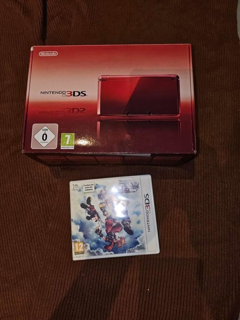 3ds rouge m&eacute;tallique + jeu Kingdom Hearts Consoles et jeux vidéos