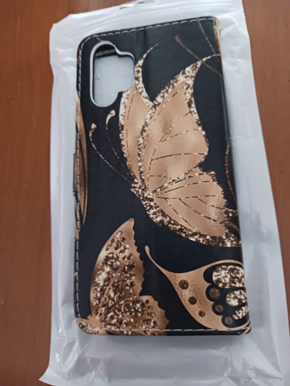 &Eacute;TUI EN CUIR NOIR MOTIFS PAPILLONS ? DOR&Eacute;S Tlphones et tablettes