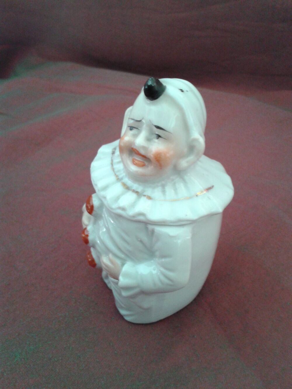 Moutardier ancien en porcelaine en forme de pierrot 