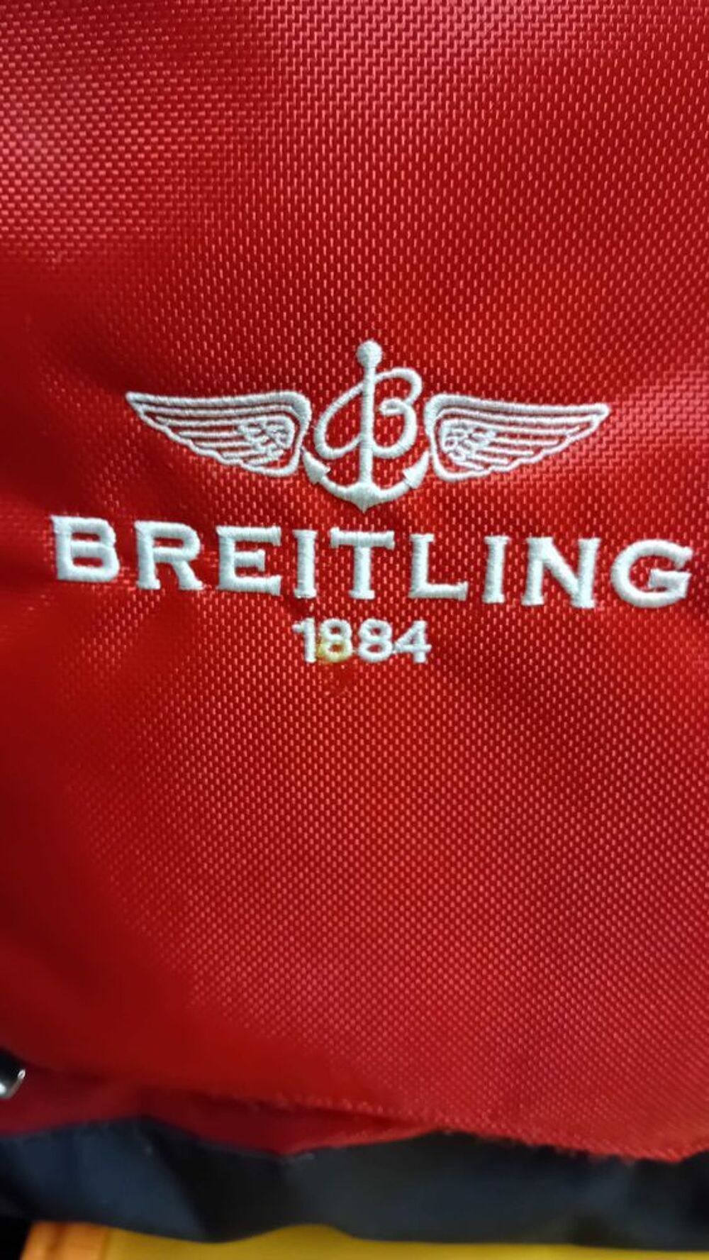 Breitling 1884 sac a dos rouge tbe 