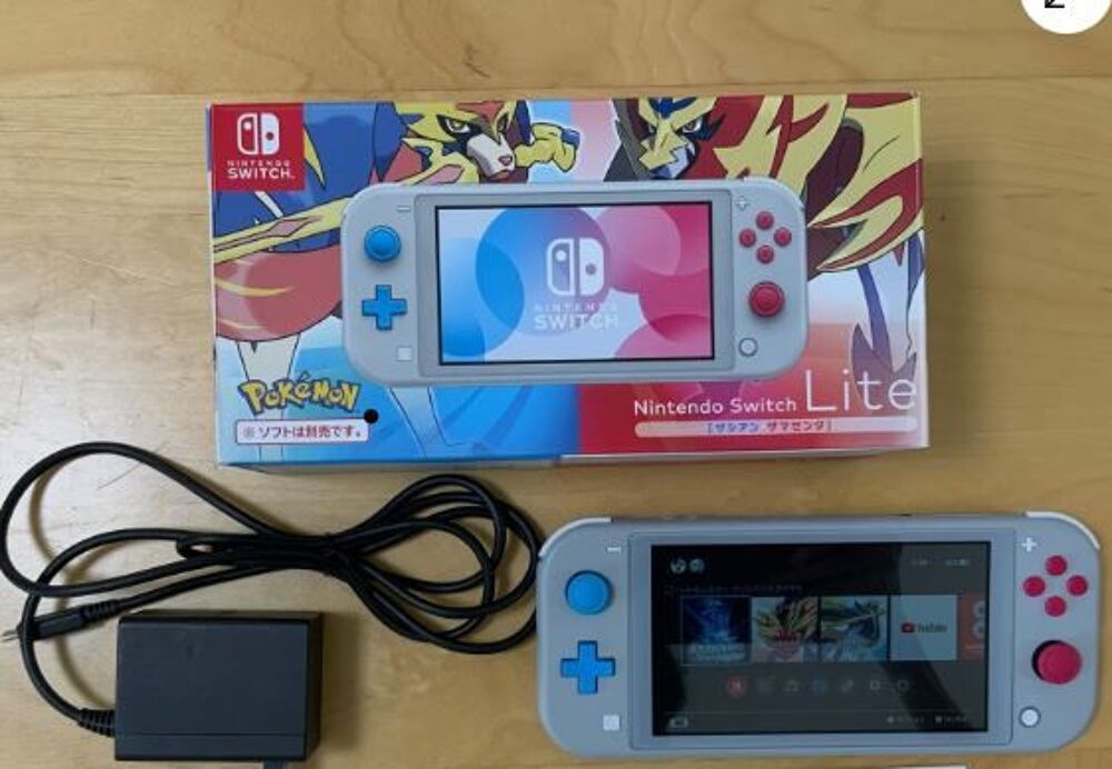 nintendo switch lite &eacute;dition pok&eacute;mon puis un jeux. Consoles et jeux vidéos