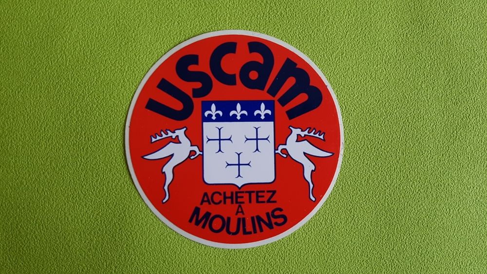 AUTOCOLLANT USCAM 