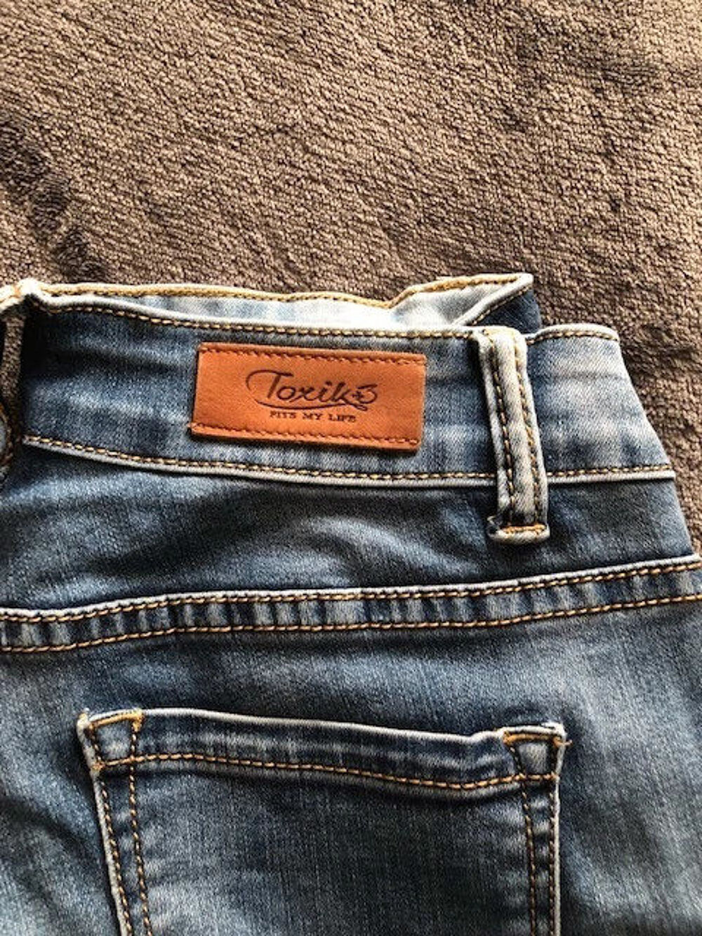 Jeans moulant Vêtements