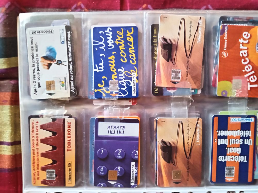 600 t&eacute;l&eacute;cartes don 40 &eacute;trang&egrave;res+ album sous blister 