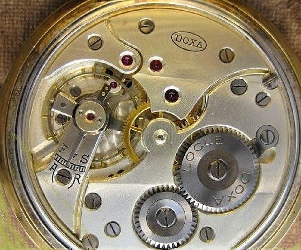 MONTRE GOUSSET SUISSE DOXA EN OR 18 KT Bijoux et montres