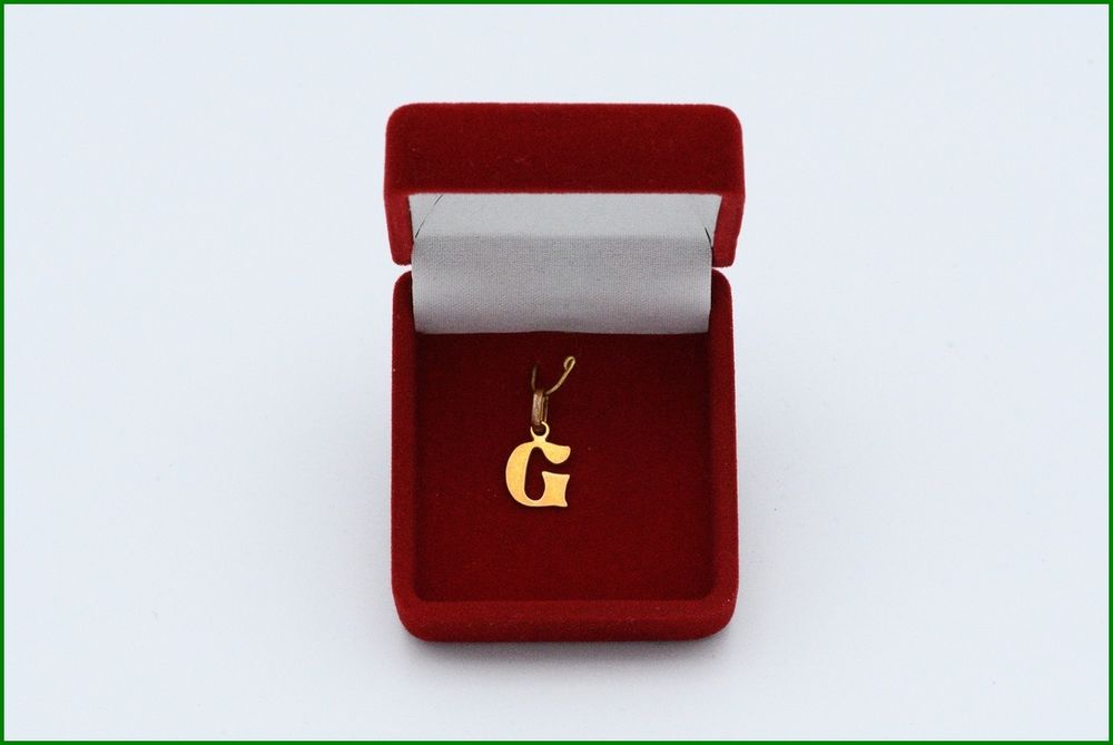 pendentif initiale G 
Bijoux et montres