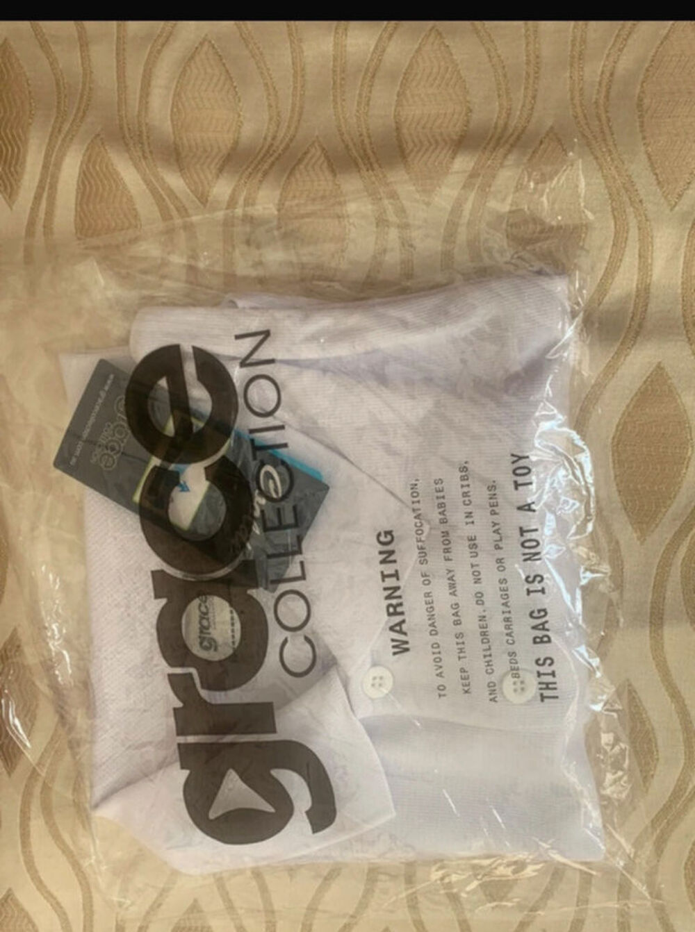 Polo blanc Marque Grace
Collection - Taille S Vêtements