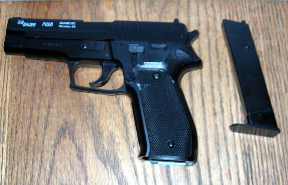 &eacute;change Sig Sauer P226. 