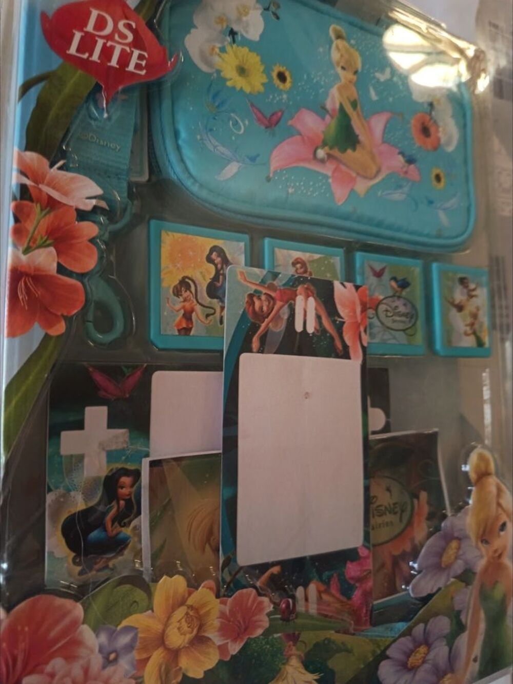 DS LiTE ROSE TBE +26 jeux + pack neuf sacoche Disney F&eacute;e Clo Consoles et jeux vidéos