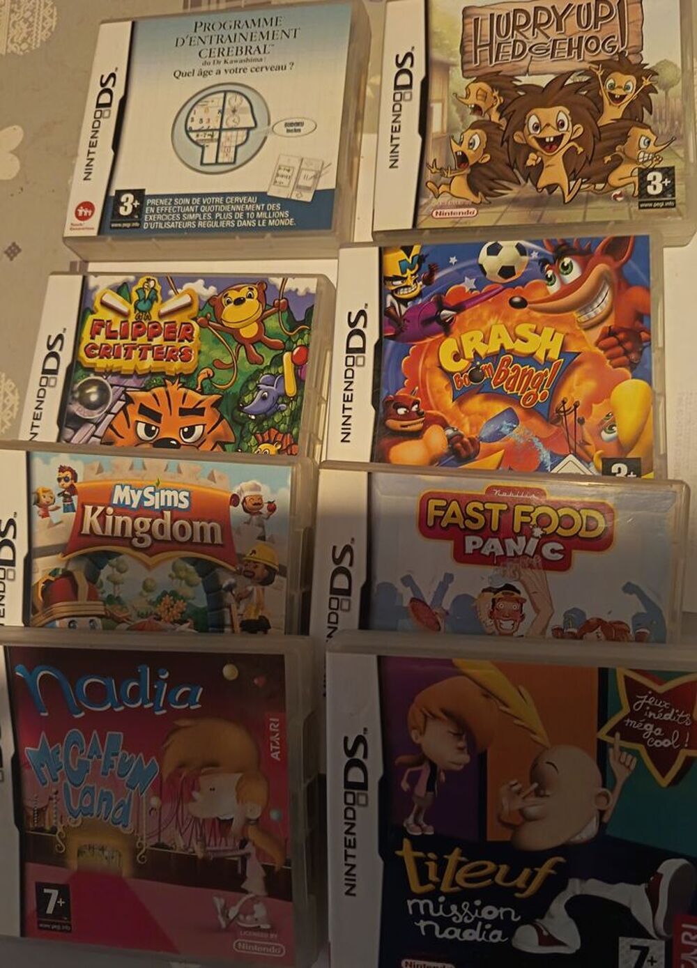 DS LiTE ROSE TBE +26 jeux + pack neuf sacoche Disney F&eacute;e Clo Consoles et jeux vidéos