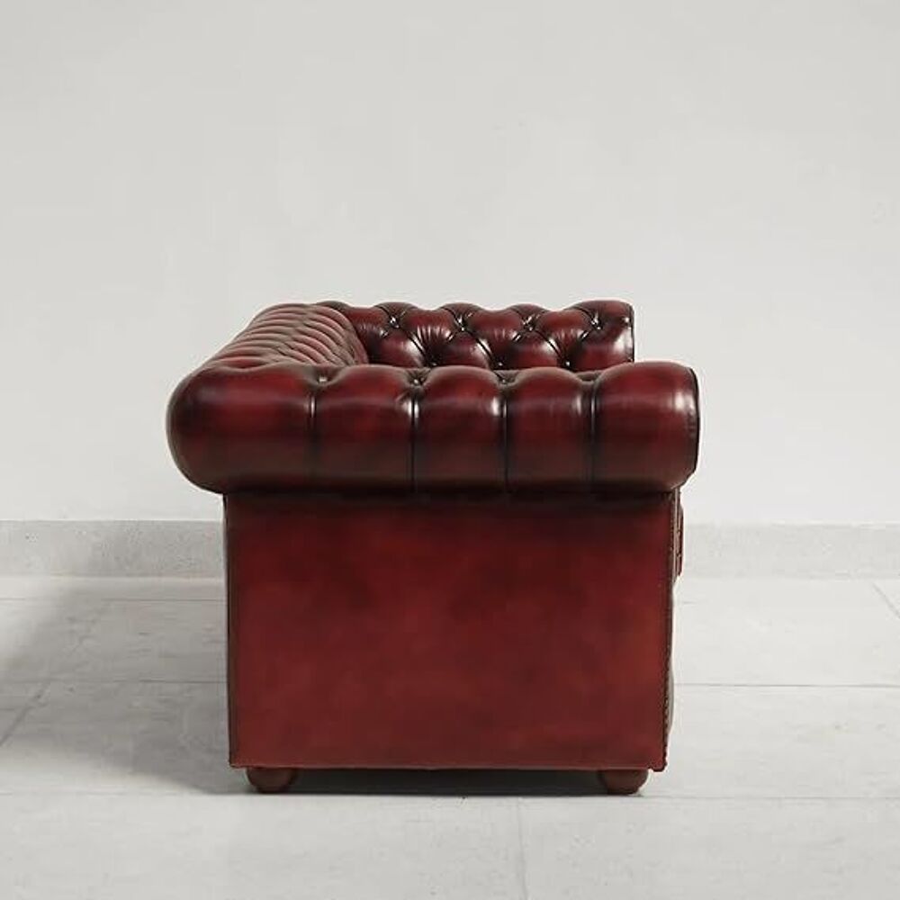 Fauteuil Chesterfield en cuir bourgogne, structure en teck Meubles