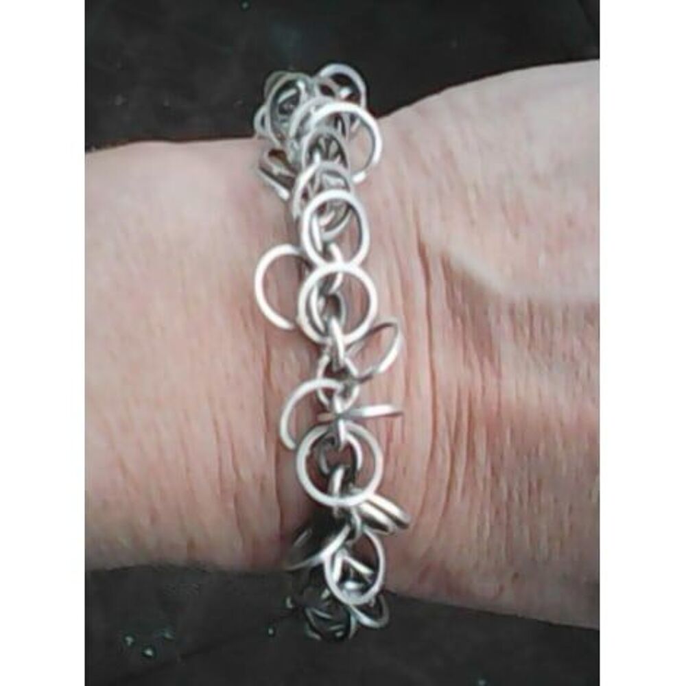 Bracelet anneaux entrem&ecirc;l&eacute;s en acier Bijoux et montres