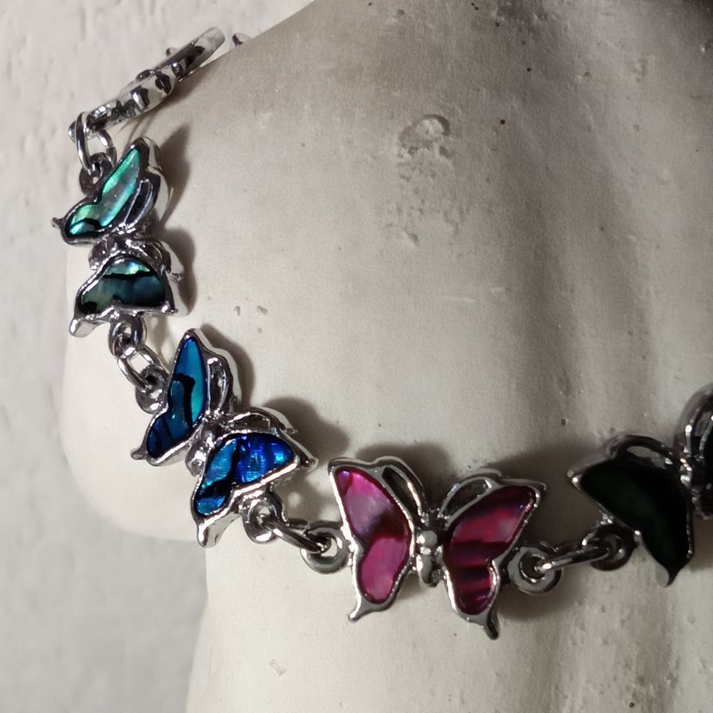 Joli bracelet avec papillons en nacre abalone Bijoux et montres