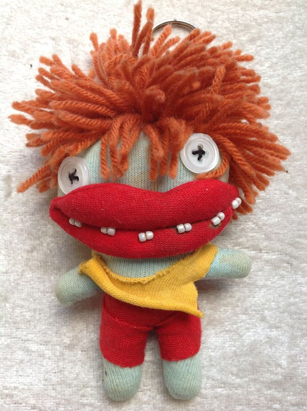 PORTE CL&Eacute; RASTA YEUX BOUTONNEUX DENTS PERL&Eacute;ES Décoration