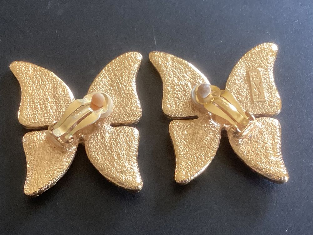 Boucle d'oreille Yves saint Laurent Bijoux et montres