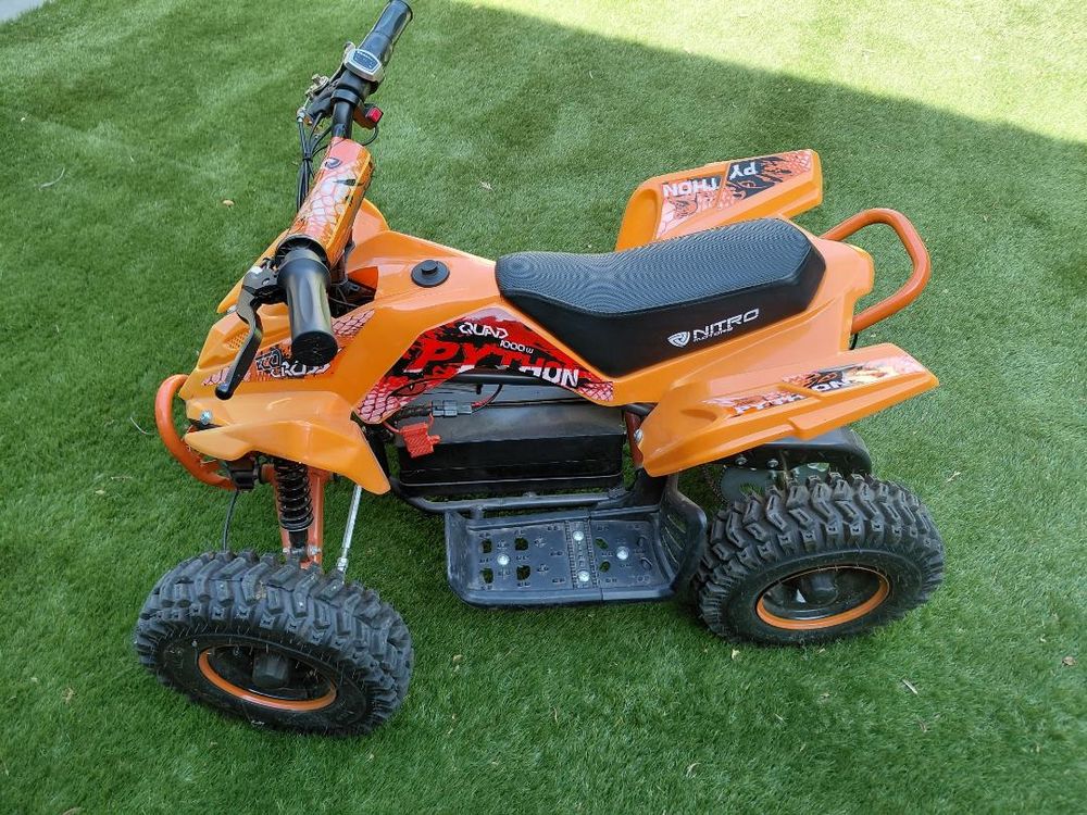QUAD LMR &eacute;lectrique orange enfant 1000 W TBE Jeux / jouets