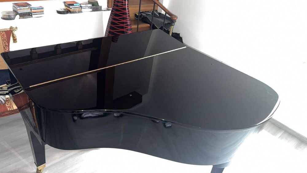 un piano &agrave; queue Wurlitzer,
Mod&egrave;le : C153 Instruments de musique