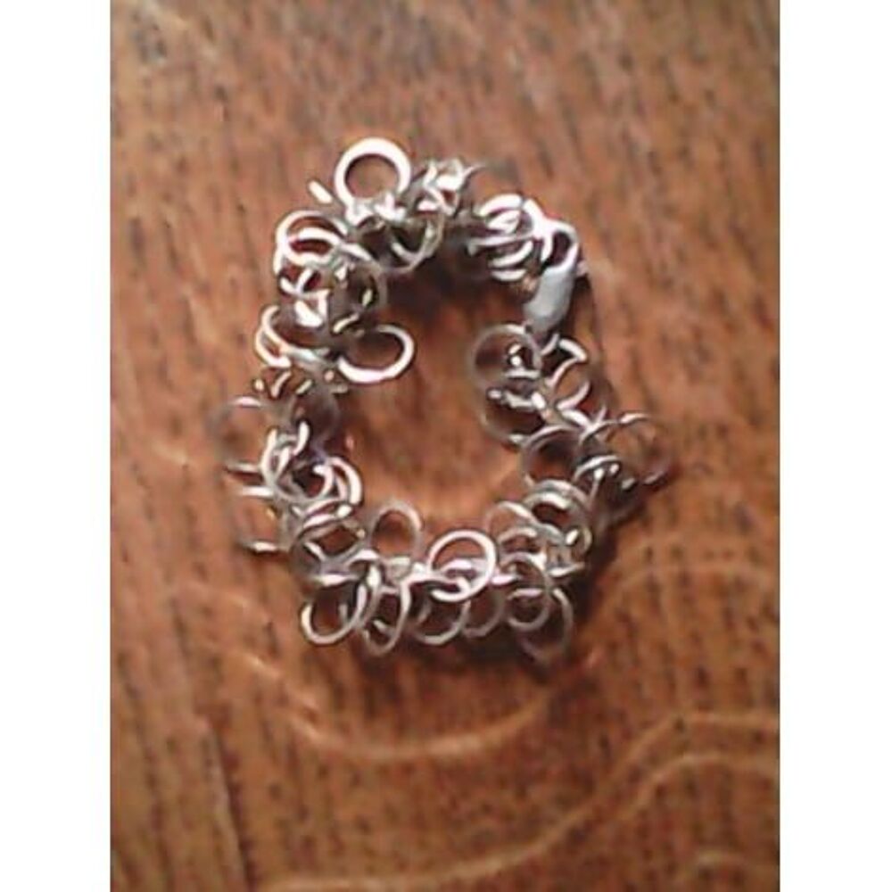 Bracelet anneaux entrem&ecirc;l&eacute;s en acier Bijoux et montres