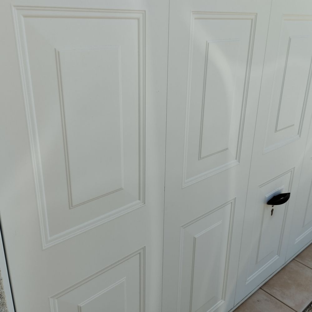 Porte garage basculante Jardin