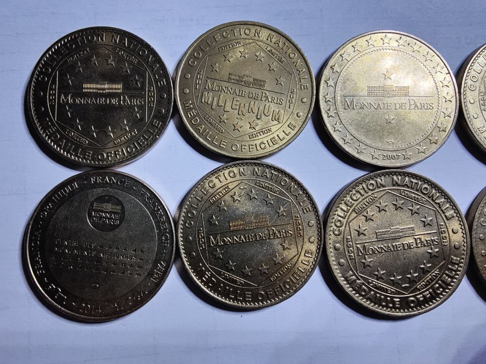 Lot de 10 jetons de la monnaie de Paris diff&eacute;rents. 