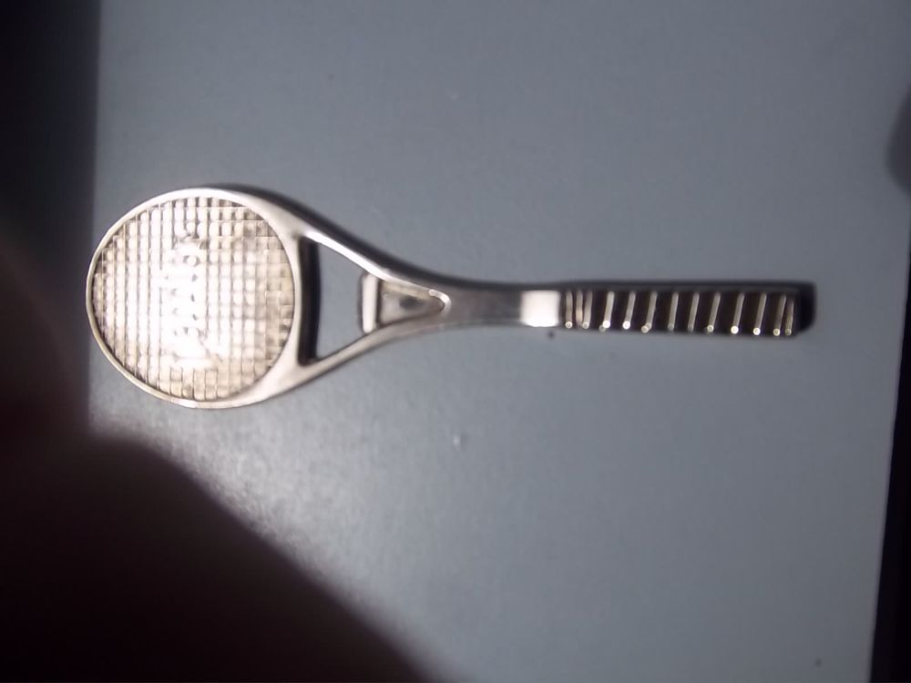D&eacute;capsuleur raquette de tennis Perrier 