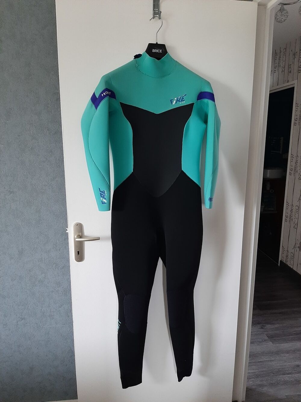 Combinaison int&eacute;grale n&eacute;opr&egrave;ne noir turquoise Sports