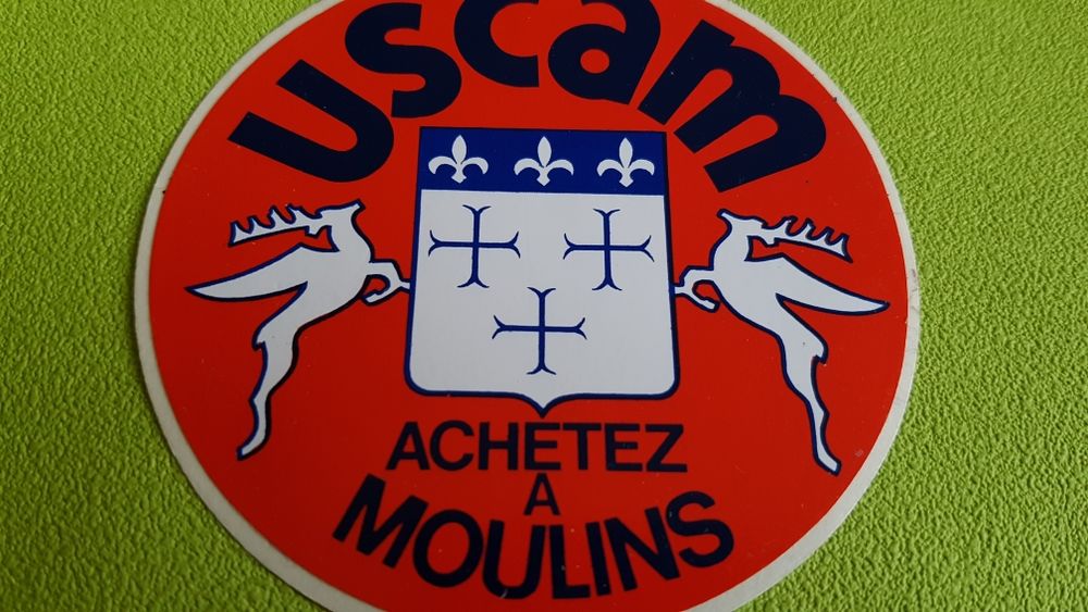 AUTOCOLLANT USCAM 
