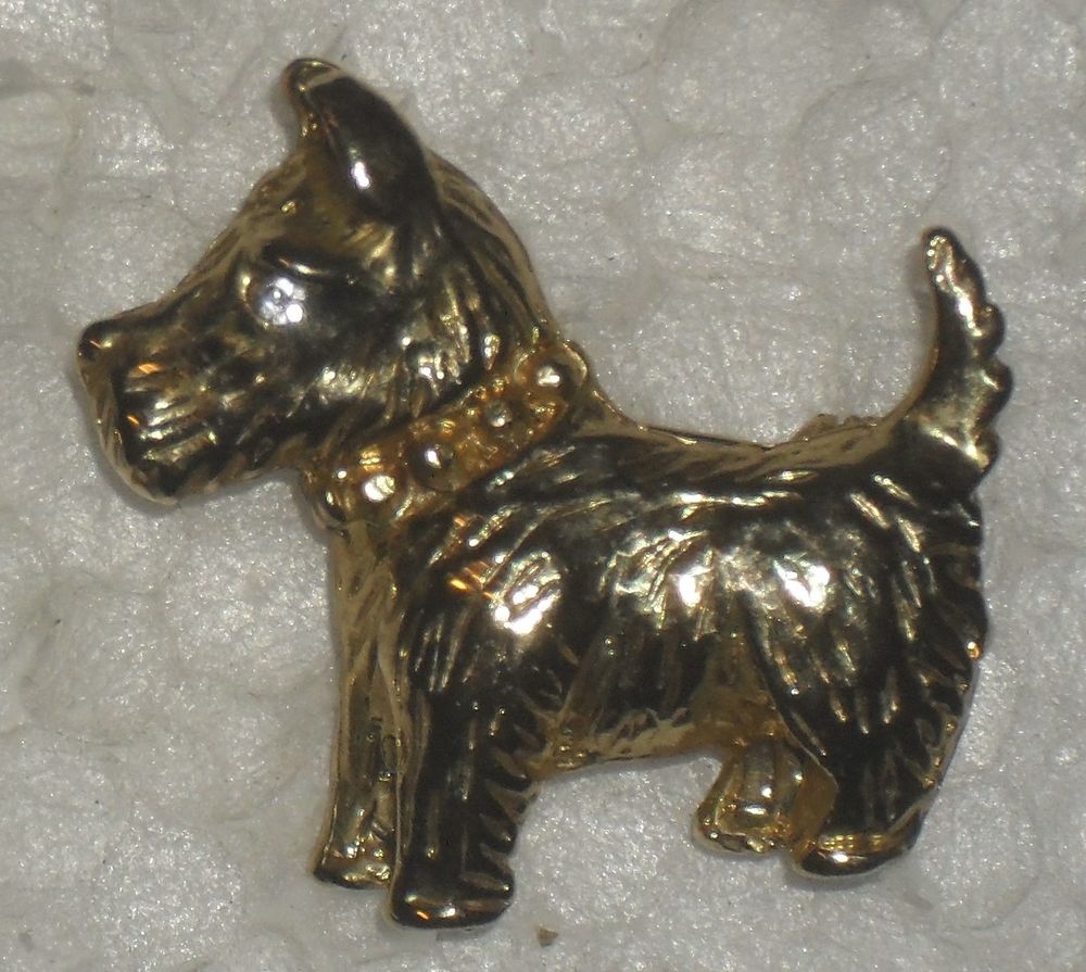 Lot de 2 broches dor&eacute;es Dauphin et Chien. Bijoux et montres