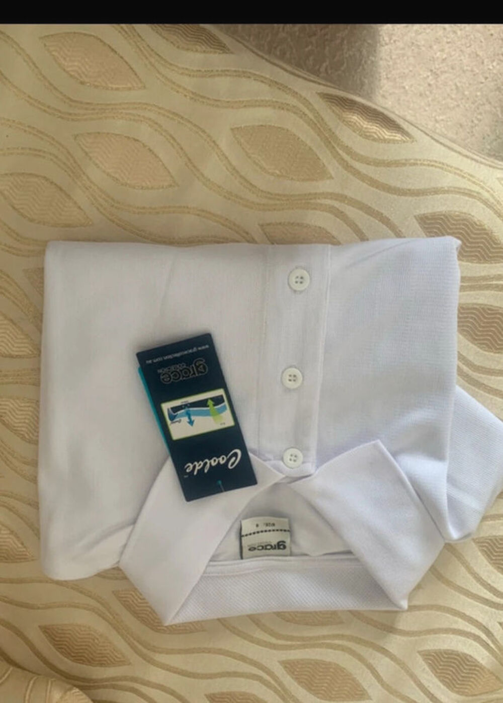 Polo blanc Marque Grace
Collection - Taille S Vêtements