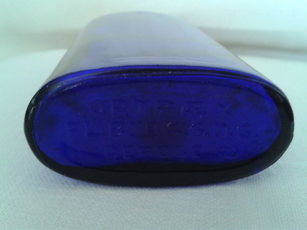 Bouteille ancienne OPTRAEX bleue cobalt 