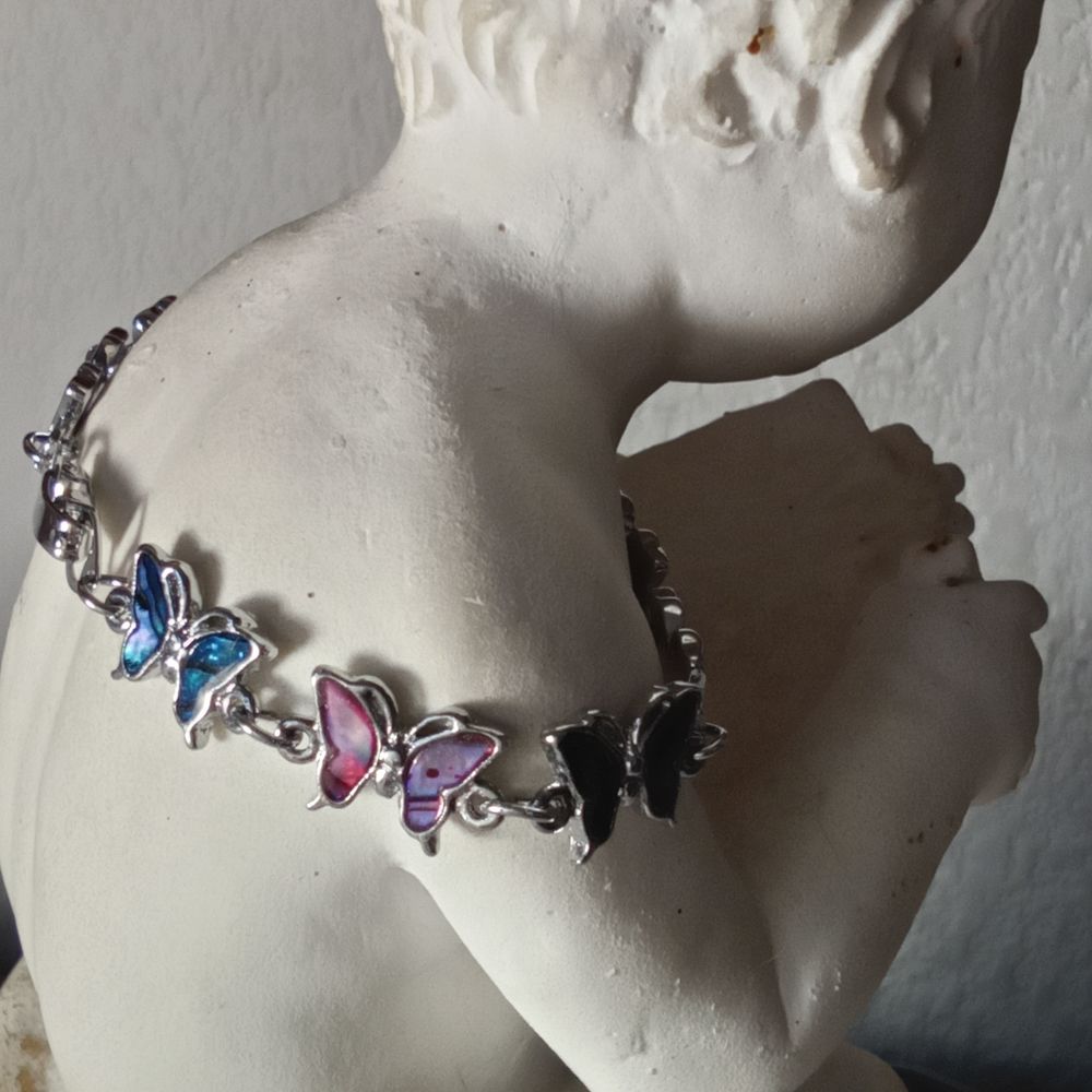 Joli bracelet avec papillons en nacre abalone Bijoux et montres