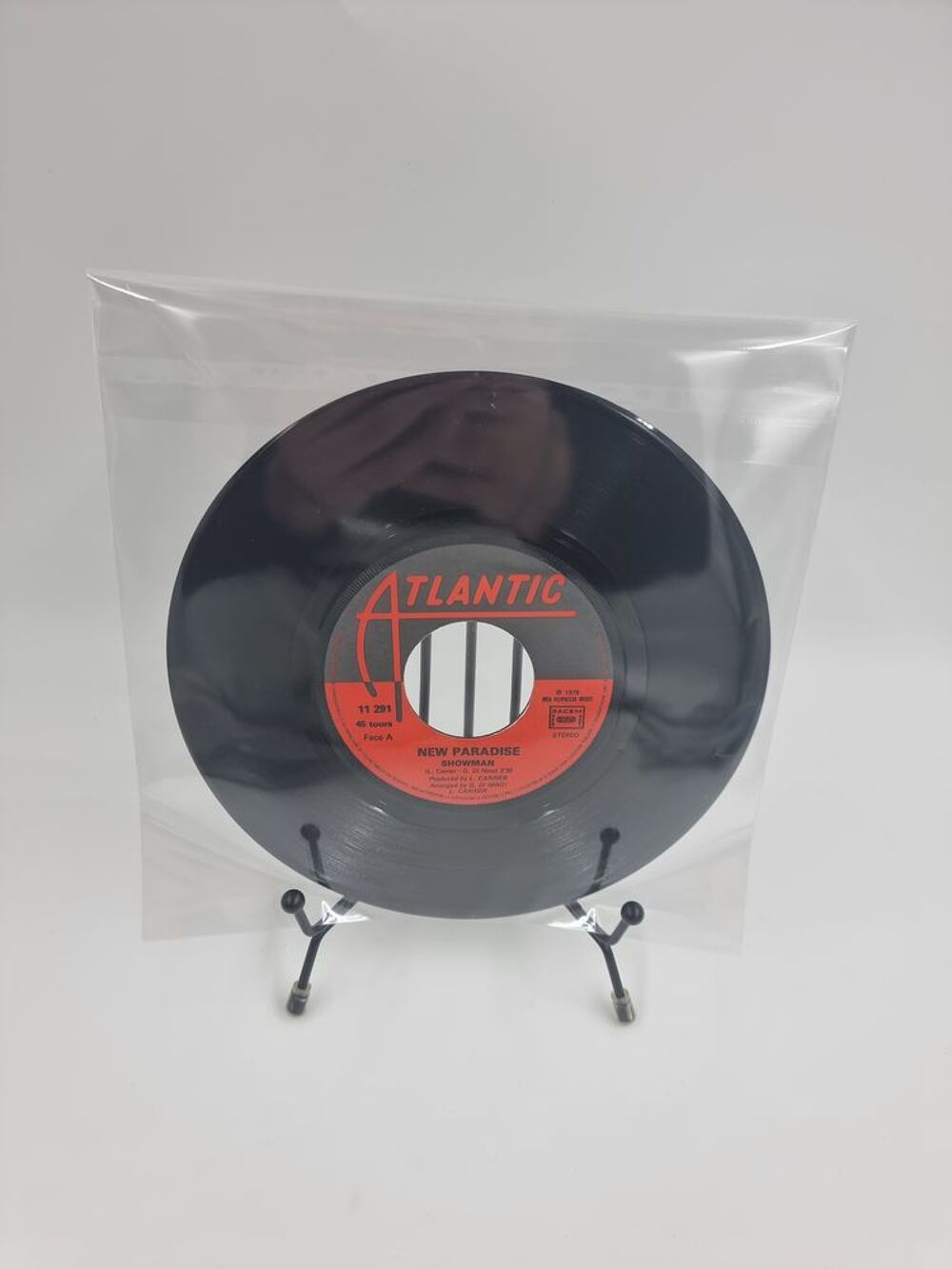 Vinyle 45 tours New Paradise : Showman / In the Laser Beams CD et vinyles