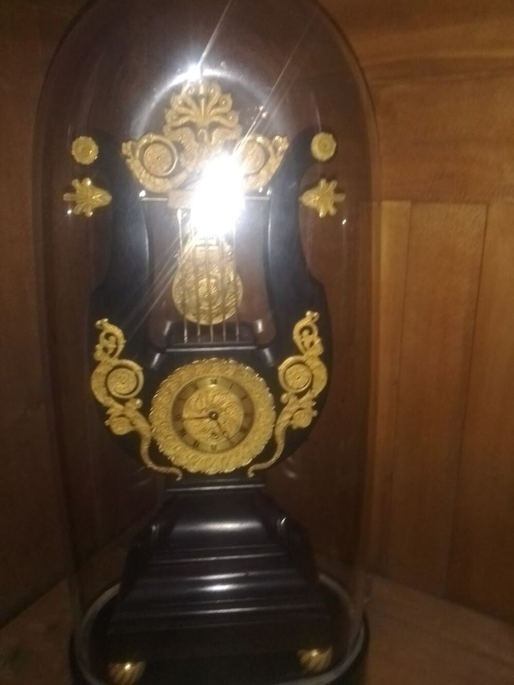 Pendule lyre sous globe empire 