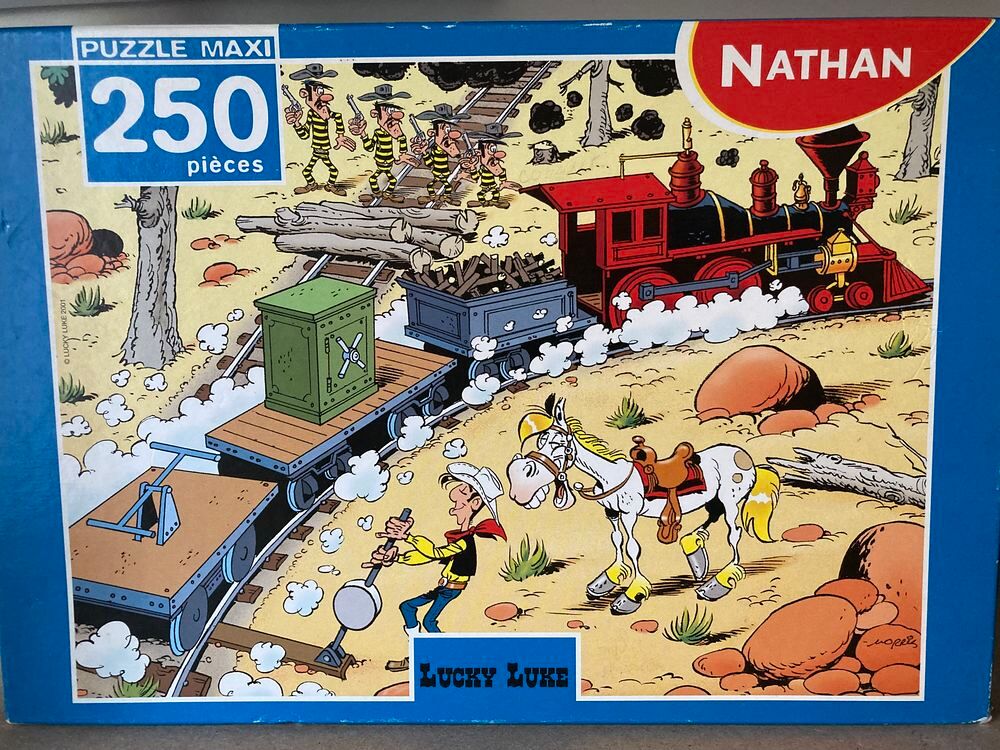Puzzle Nathan Lucky Luke 250 pi&egrave;ces L'attaque rat&eacute;e Jeux / jouets