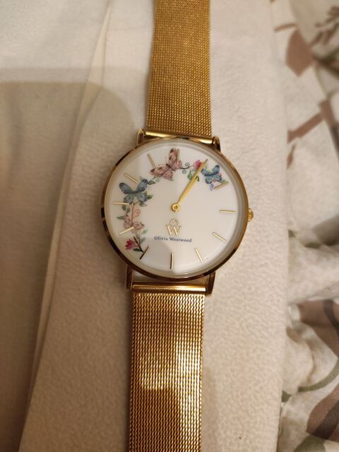 Montre acier inoxydable dor� Olivia Westwood. Neuve. 220 Verneuil-sur-Seine (78)