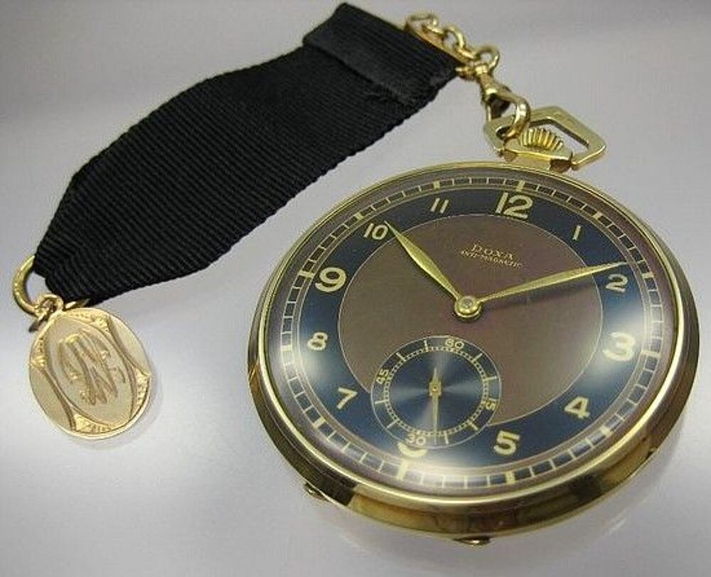 MONTRE GOUSSET SUISSE DOXA EN OR 18 KT Bijoux et montres