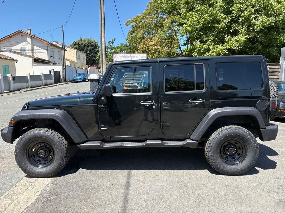 Wrangler 2.8 CRD 200 Unlimited Sport 2012 occasion 33560 Carbon-Blanc
