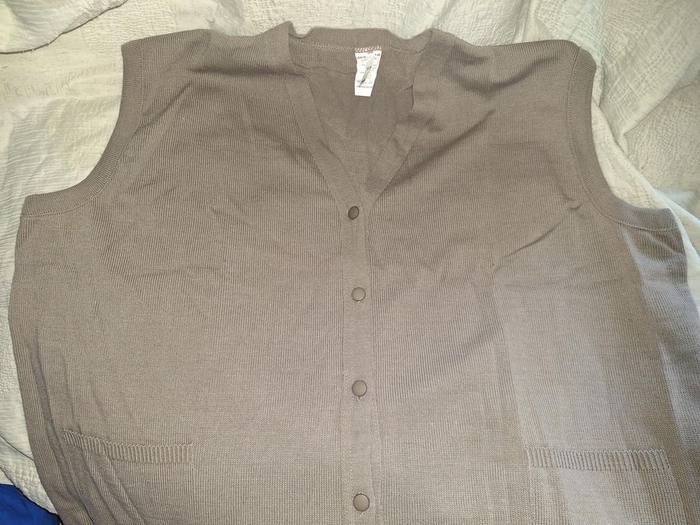 Gilet &eacute;l&eacute;gant neuf sans manche Vêtements