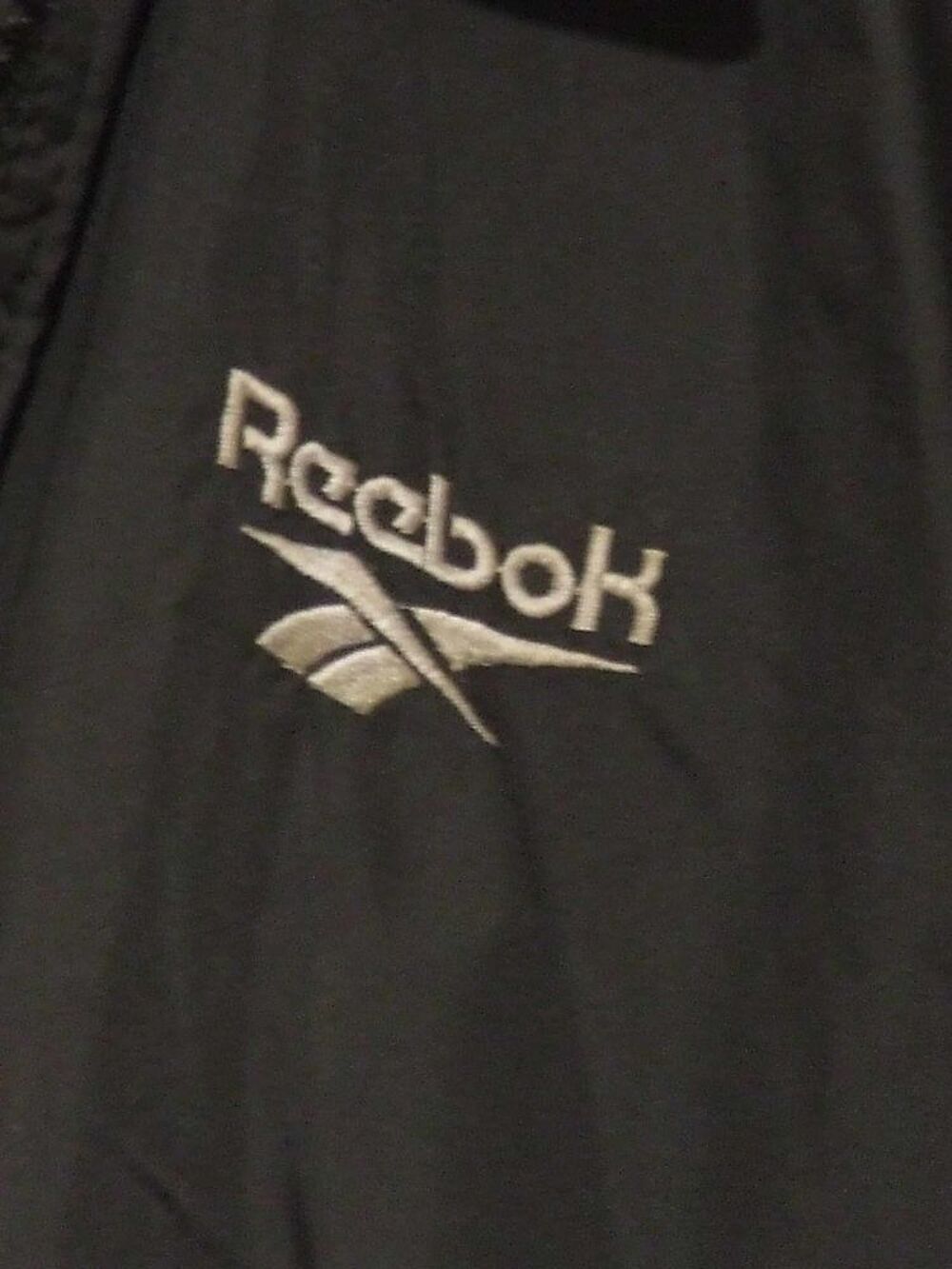 Blouson coupe-vent REEBOK noir T. 8&nbsp;ans, TBE Vêtements enfants