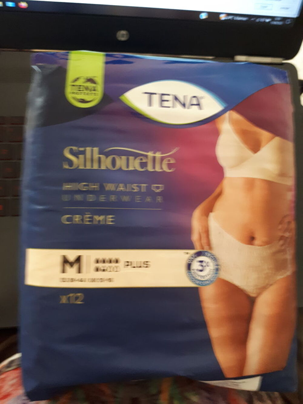 slips couches Tena silhouette couleur cr&egrave;me taille haut Vtements