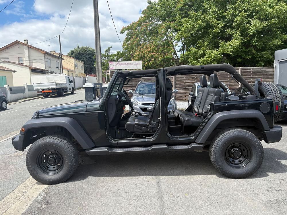 Wrangler 2.8 CRD 200 Unlimited Sport 2012 occasion 33560 Carbon-Blanc