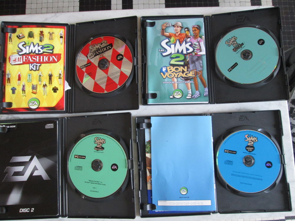 Lot de 4 disques additionnels Les Sims 2 (Jeu vid&eacute;o PC) Consoles et jeux vidéos