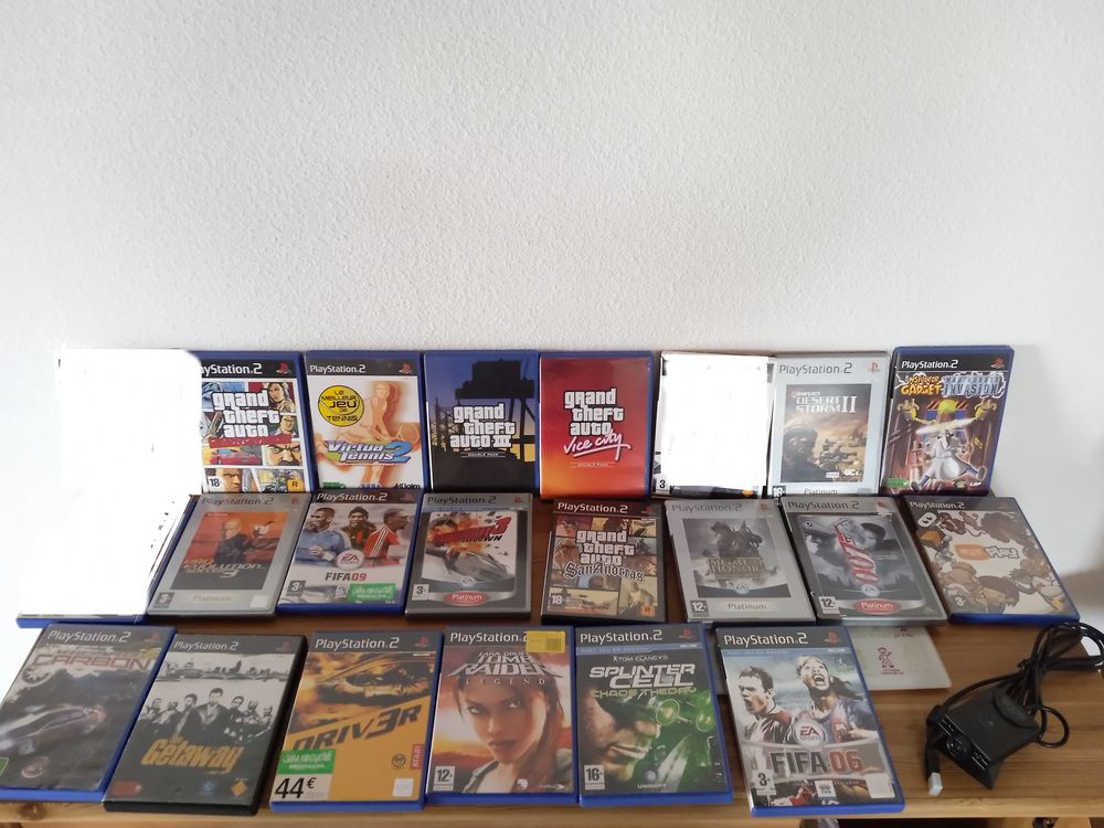 Lot de 19 jeux vid&eacute;os + webcam pour Playstation 2 Consoles et jeux vidéos