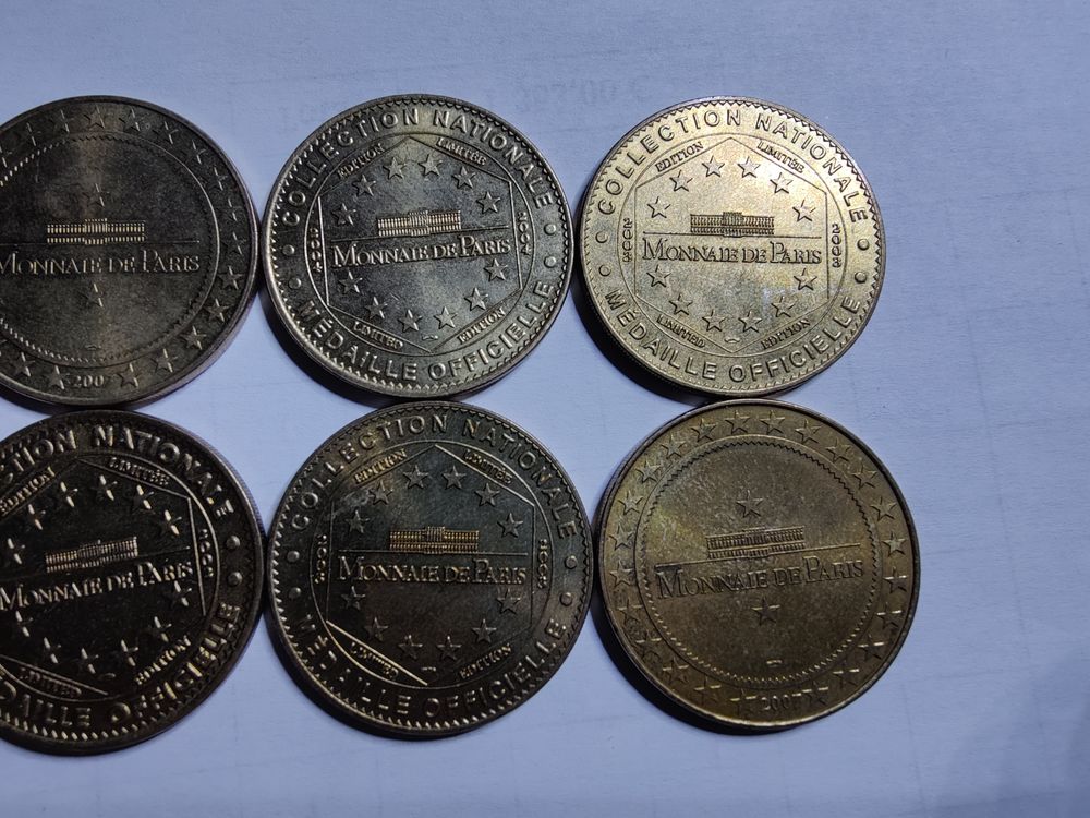 Lot de 10 jetons de la monnaie de Paris diff&eacute;rents. 