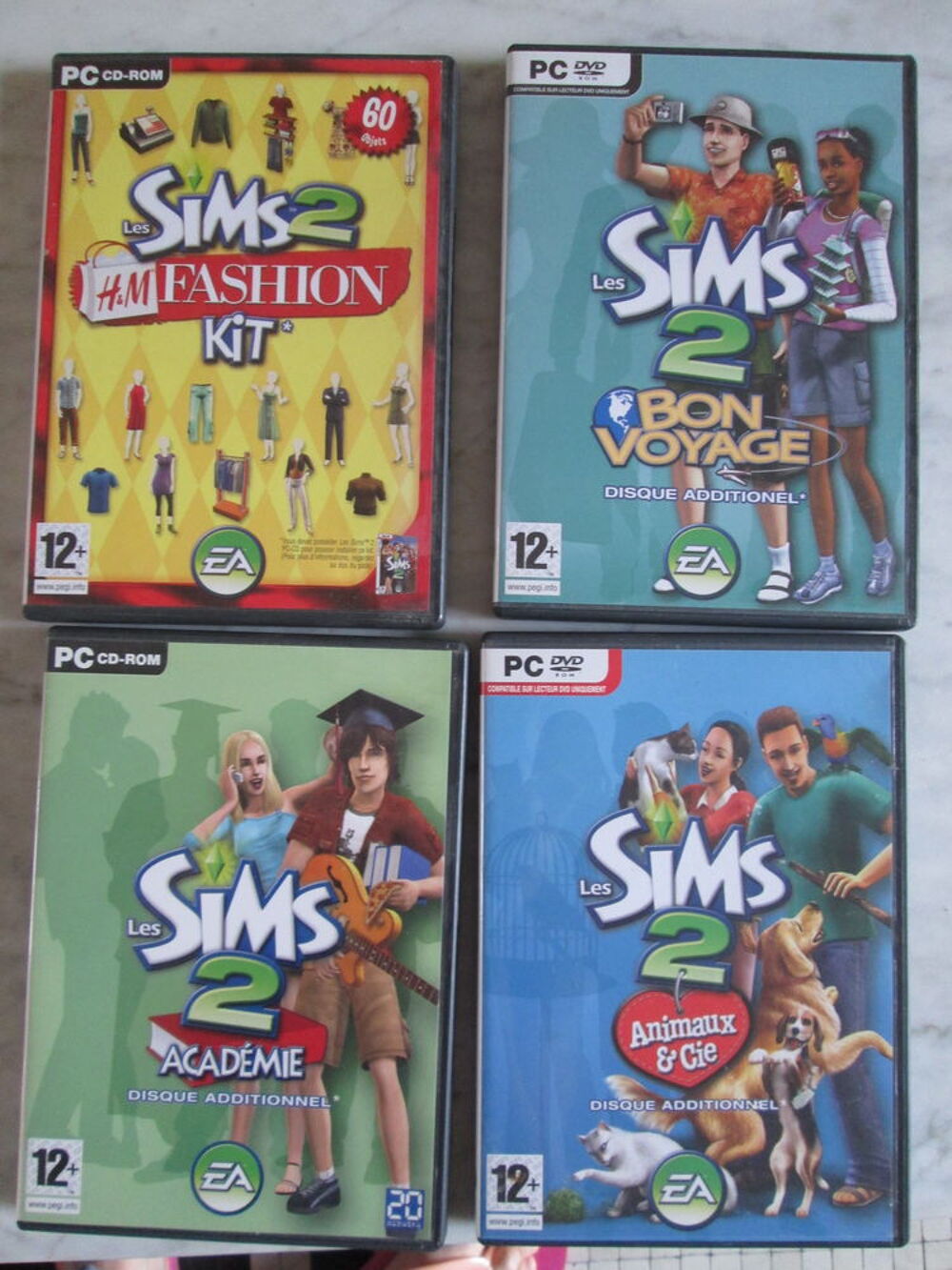 Lot de 4 disques additionnels Les Sims 2 (Jeu vid&eacute;o PC) Consoles et jeux vidos